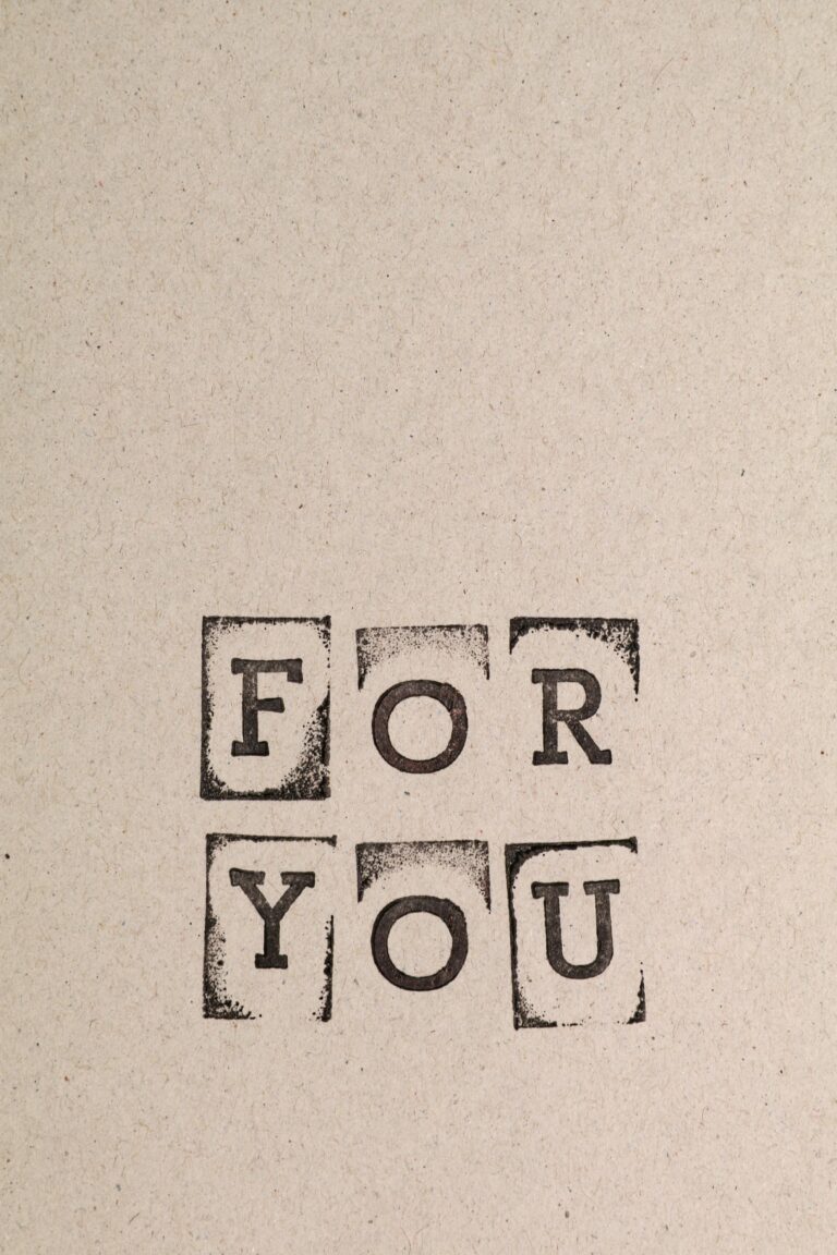 Minimalist cardboard design with stamped 'For You' text, perfect for personalized messages.